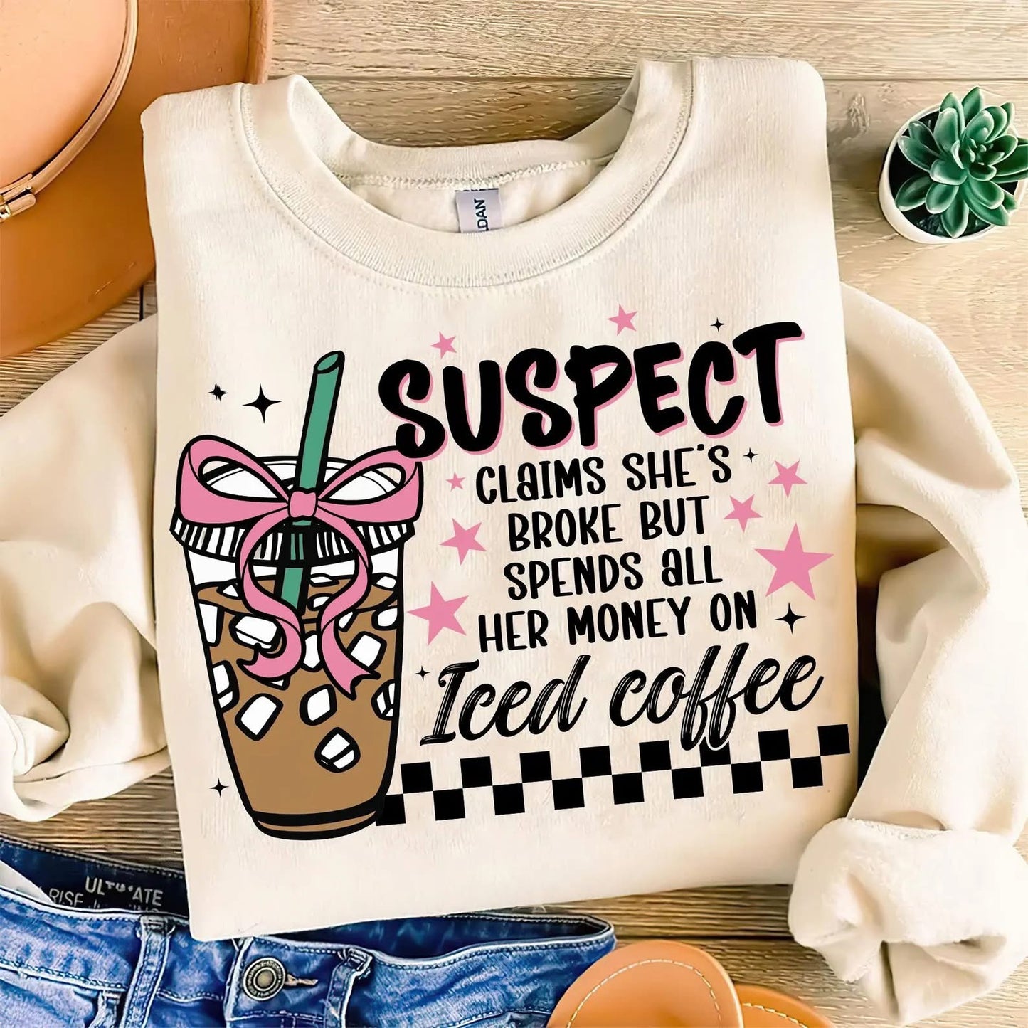 Suspect claims she’s broke but spends all her money on iced coffee shirt