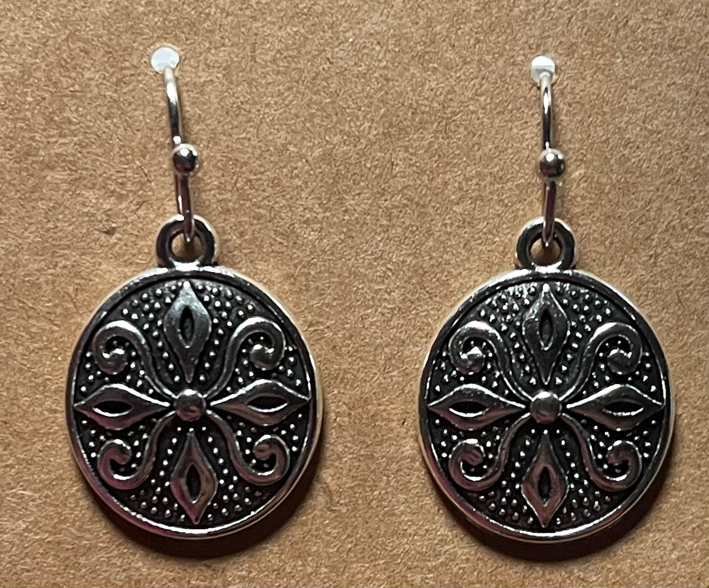 Silver sheild design earrings