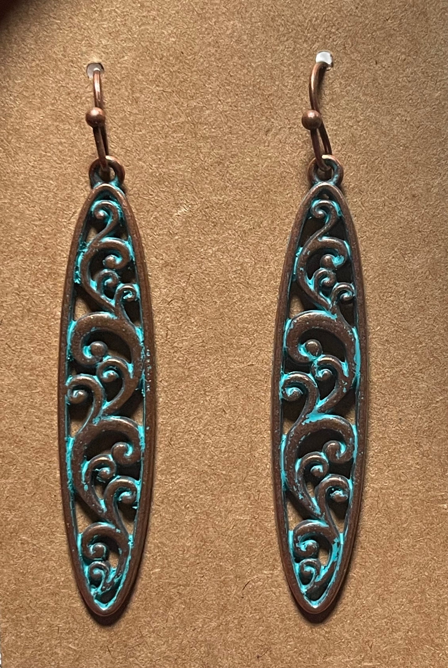 Long scroll design earrings